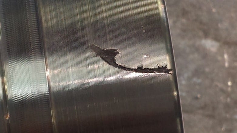 Surface imperfections to be removed on a raw steel block