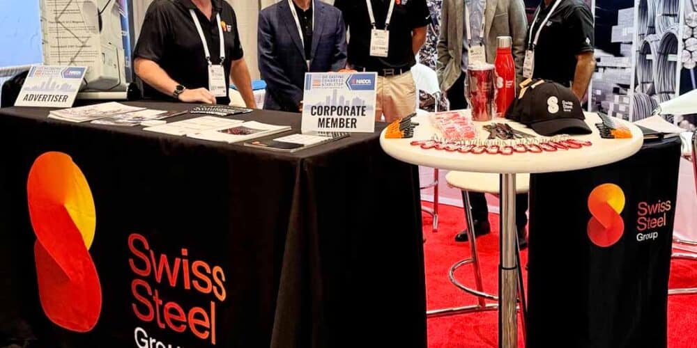 Engineer Daniele Magistroni of Bonomi Acciai with the Swiss Steel Group team (Steven Smith, John Stocker, Daniel Frie, Mike Pellicane) at the NADCA 2025 trade show booth, an international event on die casting.